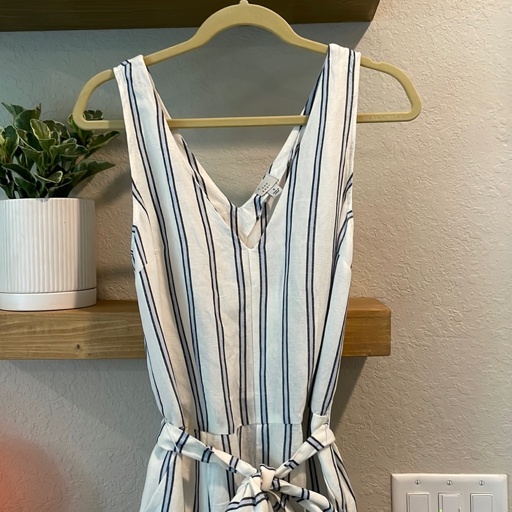 Brand new linen jumpsuit with tags. Size s
